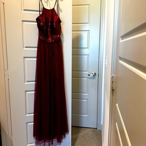Deep red formal halter and backless sequin maxi dress.